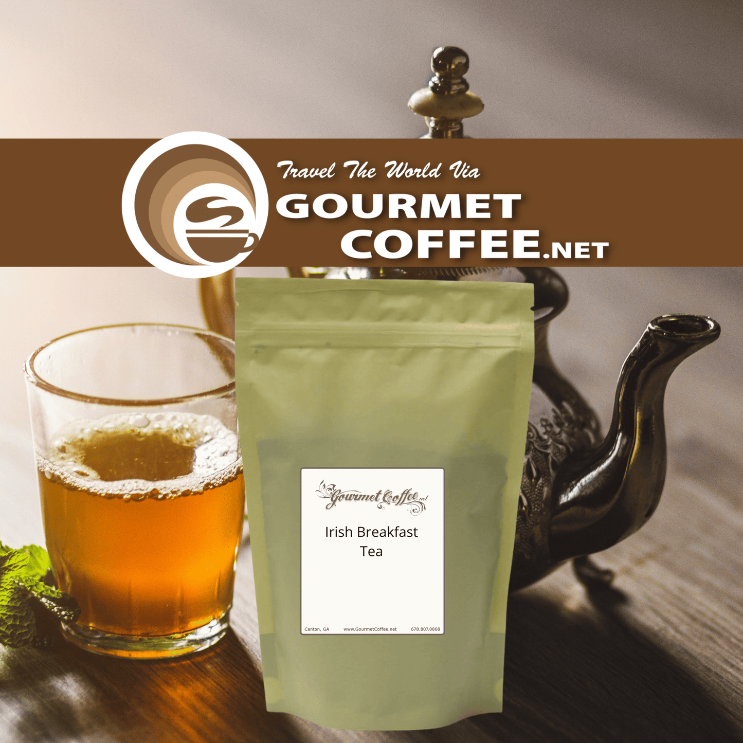 A stand-up pouch of Gourmet Coffee.net Irish Breakfast Tea stands on a wooden surface next to a glass of tea and a dark teapot, with a Gourmet Coffee.