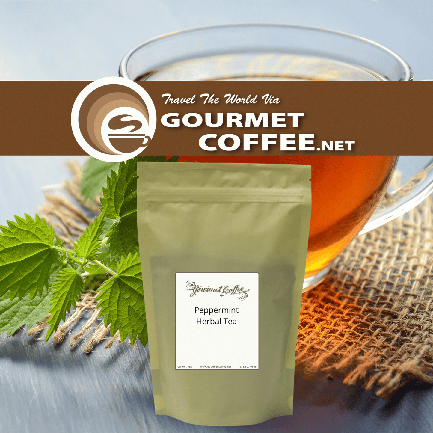 A stand-up pouch of Gourmet Coffee.net Peppermint Herbal Tea centered in the foreground, with a glass of amber tea, mint leaves, and burlap in the background.