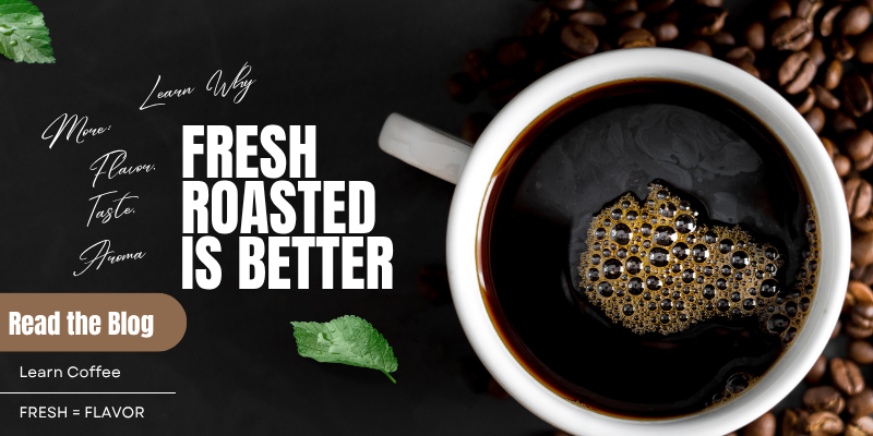 Cup of Coffee with coffee beans on a black surface.  Text reads Learn Why Fresh Roasted is Better.