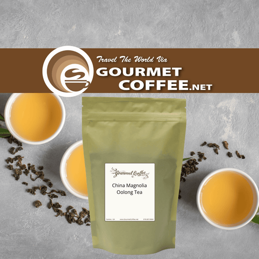 A stand-up pouch of Gourmet Coffee.net China Magnolia Oolong Tea centered on a gray textured background, with two white cups of brewed tea and scattered tea leaves around it.