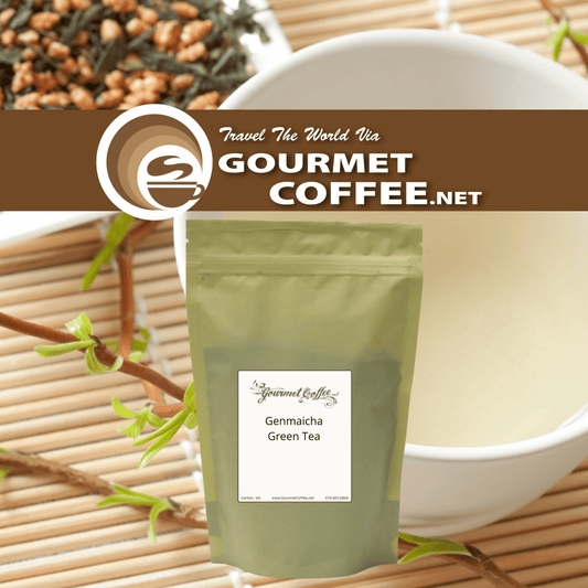 A stand-up pouch of Gourmet Coffee.net GenmaiCha Green Tea centered on a bamboo mat, with a white bowl of milk behind it and loose tea leaves at the top.