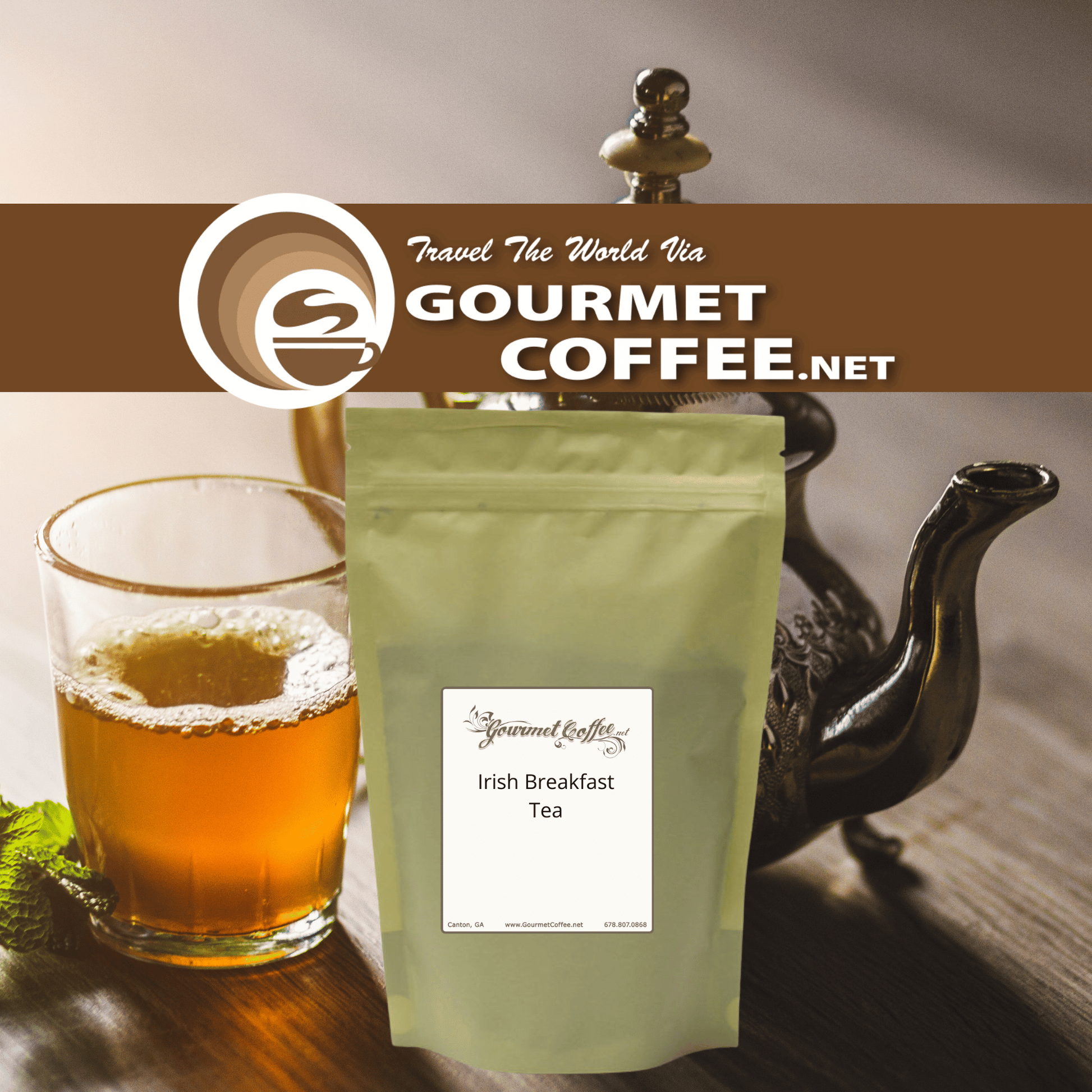 A stand-up pouch of Gourmet Coffee.net Irish Breakfast Tea stands on a wooden surface next to a glass of tea and a dark teapot, with a Gourmet Coffee.