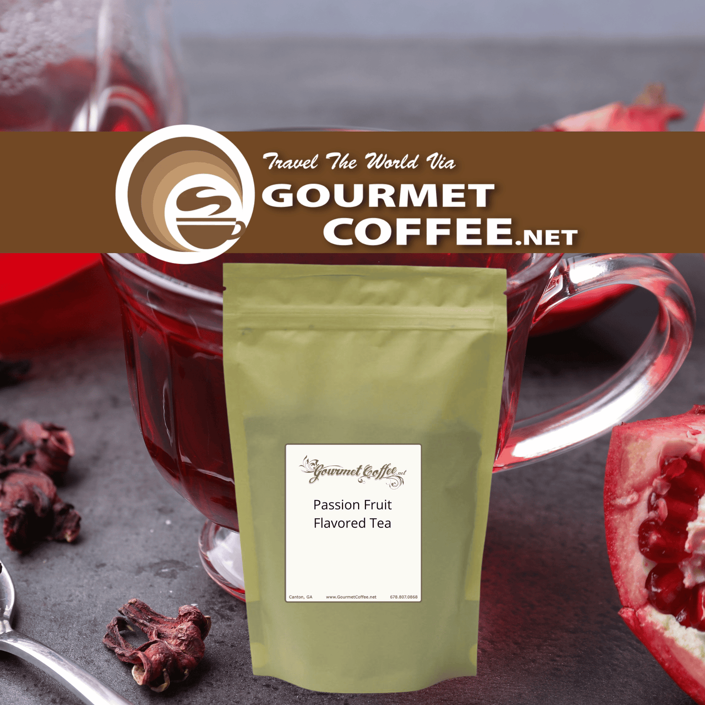 A stand-up pouch of Gourmet Coffee.net Passion Fruit Flavored Tea centered in front of a glass mug filled with dark red tea, with dried fruit pieces and a sliced pomegranate on a dark tabletop.